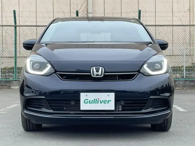 ホンダ フィット e:HEVホーム 東京都 2024(令6)年 0.2万km ミッドナイトブルービームM 純正９型ＳＤナビ＆フルセグ　/ホンダセンシング　/・パーキングセンサーシステム　/・アダプティブクルーズコントロール　/・衝突軽減ブレーキ　/・路外逸脱警報システム　/・歩行者事故低ステアリング/・標識認識機能/・先行車発進お知らせ機能/・路外逸脱警報/・車線維持支援システム/・トラフィックジャムアシスト/・オートハイビーム/ＬＥＤヘッドライト　/ビルトインETC/プッシュエンジンスタート/純正フロアマット/保証書＆取説/Wエアバック＆ABS