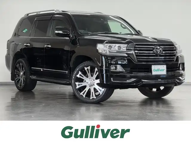 トヨタ ランドクルーザー ZX 三重県 2018(平30)年 6.3万km ブラック プレミアムガソリン/フルタイム4WD/MTモード付フロア6AT/純正 9.2インチナビ*1/（AM/FM/CD/DVD/Blu-ray/SDREC/SD/USB/Bluetooth/VTR/AUX/TV）/トヨタプレミアムサウンド（12スピーカー）*/マルチテレインモニター*/モデリスタエアロ（F/S/R下）/社外後席モニター/ドライブレコーダー 前後/社外セキュリティ/ETC2.0/Toyota Safety Sense/●PCS/●LDA/●レーダークルコン/●AHB/・クリアランスソナー&バックソナー/・ブラインドスポットモニター/・リヤクロストラフィックアラート*1/など/装備/・パワーバックドア（上側）*/・ルーフレール（ブラック）*/・寒冷地仕様*/・ムーンルーフ/・茶革シート/・シートヒーター（D/N/2nd左右）/ベンチレーション（D/N）/・ステアリングヒーター/・パワーシート（D/N）（2nd前後パワースライド機構）/・左右＆後席左右独立オートエアコン/・LEDヘッドランプ/・オートワイパー/・社外22inAW/・ガナドール4本出しマフラー/・社外テールレンズ（純正あり）/など/メカニズム系装備/・高低調整サスペンション/・バリアブルギヤレシオステアリング/など/*…OP装備
