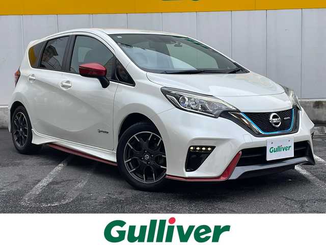 日産 ノート e－パワー ニスモ 東京都 2017(平29)年 6.9万km ブリリアントホワイトパール 純正メモリナビ【MJ117D-W】/・DTV/BT/CD/DVD/SD/ラジオ/バックカメラ/ドライブレコーダー/インテリジェントエマージェンシーブレーキ/車線逸脱警報/スエード調スポーツシート/純正16インチAW/レザー/アルカンターラコンビステアリング/ステアリングスイッチ/ETC/プッシュEgスタート/ストップ/インテリジェントキー×2/純正LEDヘッドランプ/LEDハイパーデイライト/ターンランプ付電動格納ドアミラー/純正フロアマット/取扱説明書/ナビ取扱説明書/新車時保証書