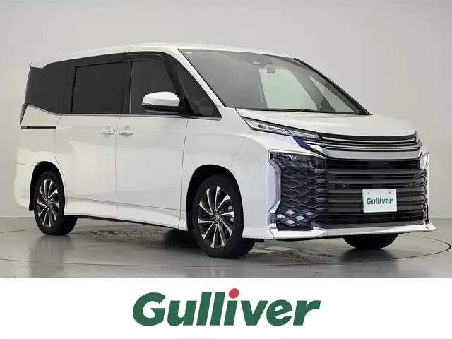 トヨタ ヴォクシー S－Z 滋賀県 2023(令5)年 0.7万km ホワイトパールクリスタルシャイン 禁煙車/純正ディスプレイナビ/・フルセグTV・Bluetooth・CD・DVD/バックカメラ/モデリスタグリル/パワーバックドア/両側パワースライドドア/レーダークルーズコントロール/ETC2.0/前後ドラレコ/ハーフレザーシート/シートヒーター/ステアリングヒーター/LEDヘッドライト/オートライト/オートハイビーム/前後コーナーセンサー