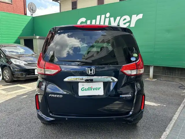 ホンダ フリード ハイブリット G ホンダセンシング 東京都 2021(令3)年 2.7万km ミッドナイトブルービームM 純正SDナビ【VXM-217VFNi】/（CD/DVD/BTオーディオ/フルセグ）/バックカメラ/Cパッケージ/・サンシェード/・前席シートヒーター/ホンダセンシング/・衝突軽減ブレーキ/・歩行者事故低減ステアリング/・アダクティブクルーズコントロール/・路外逸脱抑制機能/・標識認識機能/フリップダウンモニター【VM-１８５EN】/アクティブコーナリングライト/両側パワースライドドア/スペアキー×1/ETC/ドライブレコーダー/取扱説明書/保証書
