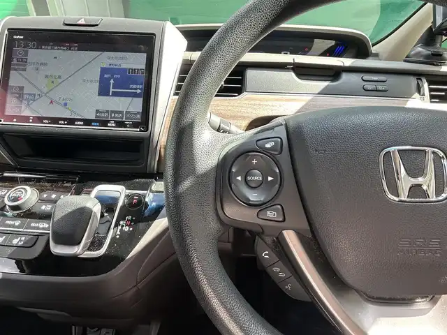 ホンダ フリード ハイブリット G ホンダセンシング 福岡県 2021(令3)年 2.7万km ミッドナイトブルービームM 純正SDナビ【VXM-217VFNi】/（CD/DVD/BTオーディオ/フルセグ）/バックカメラ/Cパッケージ/・サンシェード/・前席シートヒーター/ホンダセンシング/・衝突軽減ブレーキ/・歩行者事故低減ステアリング/・アダクティブクルーズコントロール/・路外逸脱抑制機能/・標識認識機能/フリップダウンモニター【VM-１８５EN】/アクティブコーナリングライト/両側パワースライドドア/スペアキー×1/ETC/ドライブレコーダー/取扱説明書/保証書