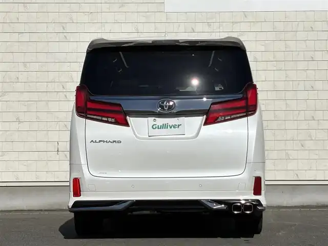 トヨタ アルファード S タイプゴールドⅡ 岩手県 2021(令3)年 7.4万km ホワイトパールクリスタルシャイン 禁煙車/4WD/モデリスタフルエアロ/モデリスタマフラー/純正ディスプレイオーディオ（ナビ機能付）/→Bluetooth/DVD/FM/AM/純正後席用フリップダウンモニター/バックカメラ/両側パワースライドドア/パワーバックドア/ハーフレザー/トヨタセーフティセンス/追従型クルーズコントロール/レーンキープアシスト/衝突軽減システム/横滑り防止装置/電子パーキング/オートブレーキホールド/オートライト/オートハイビーム/LEDヘッドライト/LEDフォグライト/純正エンジンスターター/ステアリングスイッチ/プッシュスタート/社外フロアマット/シガーソケット/スマートキー/ビルトインETC/オットマン