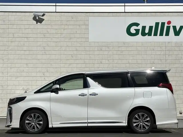 トヨタ アルファード S タイプゴールドⅡ 岩手県 2021(令3)年 7.4万km ホワイトパールクリスタルシャイン 禁煙車/4WD/モデリスタフルエアロ/モデリスタマフラー/純正ディスプレイオーディオ（ナビ機能付）/→Bluetooth/DVD/FM/AM/純正後席用フリップダウンモニター/バックカメラ/両側パワースライドドア/パワーバックドア/ハーフレザー/トヨタセーフティセンス/追従型クルーズコントロール/レーンキープアシスト/衝突軽減システム/横滑り防止装置/電子パーキング/オートブレーキホールド/オートライト/オートハイビーム/LEDヘッドライト/LEDフォグライト/純正エンジンスターター/ステアリングスイッチ/プッシュスタート/社外フロアマット/シガーソケット/スマートキー/ビルトインETC/オットマン