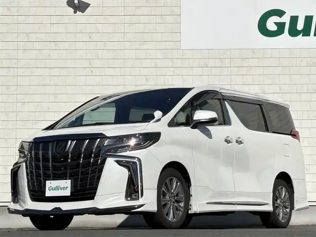 トヨタ アルファード S タイプゴールドⅡ 岩手県 2021(令3)年 7.4万km ホワイトパールクリスタルシャイン 禁煙車/4WD/モデリスタフルエアロ/モデリスタマフラー/純正ディスプレイオーディオ（ナビ機能付）/→Bluetooth/DVD/FM/AM/純正後席用フリップダウンモニター/バックカメラ/両側パワースライドドア/パワーバックドア/ハーフレザー/トヨタセーフティセンス/追従型クルーズコントロール/レーンキープアシスト/衝突軽減システム/横滑り防止装置/電子パーキング/オートブレーキホールド/オートライト/オートハイビーム/LEDヘッドライト/LEDフォグライト/純正エンジンスターター/ステアリングスイッチ/プッシュスタート/社外フロアマット/シガーソケット/スマートキー/ビルトインETC/オットマン