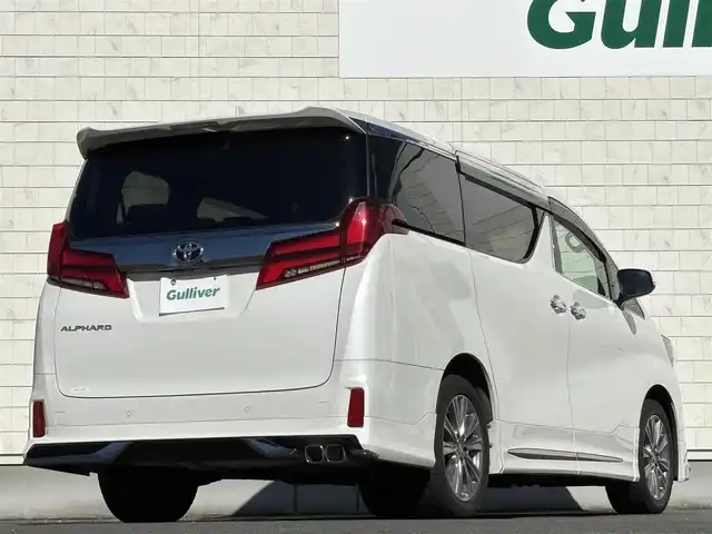 トヨタ アルファード S タイプゴールドⅡ 岩手県 2021(令3)年 7.4万km ホワイトパールクリスタルシャイン 禁煙車/4WD/モデリスタフルエアロ/モデリスタマフラー/純正ディスプレイオーディオ（ナビ機能付）/→Bluetooth/DVD/FM/AM/純正後席用フリップダウンモニター/バックカメラ/両側パワースライドドア/パワーバックドア/ハーフレザー/トヨタセーフティセンス/追従型クルーズコントロール/レーンキープアシスト/衝突軽減システム/横滑り防止装置/電子パーキング/オートブレーキホールド/オートライト/オートハイビーム/LEDヘッドライト/LEDフォグライト/純正エンジンスターター/ステアリングスイッチ/プッシュスタート/社外フロアマット/シガーソケット/スマートキー/ビルトインETC/オットマン