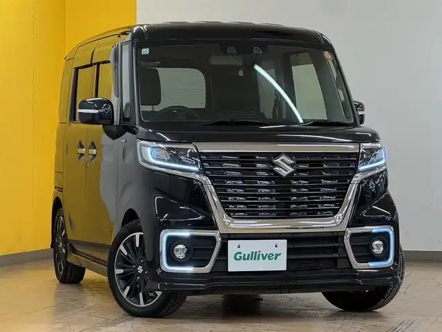 スズキ スペーシア カスタム HYBRID XS ターボ 群馬県 2021(令3)年 9万km ブルーイッシュブラックパール3 スズキセーフティサポート/・デュアルカメラブレーキサポート/・誤発進抑制機能/・後退時ブレーキサポート/・後方誤発進抑制機能/・車線逸脱警報機能/・ふらつき警報機能/・標識認識機能/・先行車発進お知らせ機能/・ハイビームアシスト/・すれ違い支援機能/・アダプティブクルーズコントロール/純正ナビ/　フルセグ/BT/CD/DVD/両側パワースライドドア/シートヒーター/ハーフレザーシート/LEDヘッドライト/フォグランプ/パドルシフト/ステアリングスイッチ/プッシュスタート/スマートキー/純正15インチAW