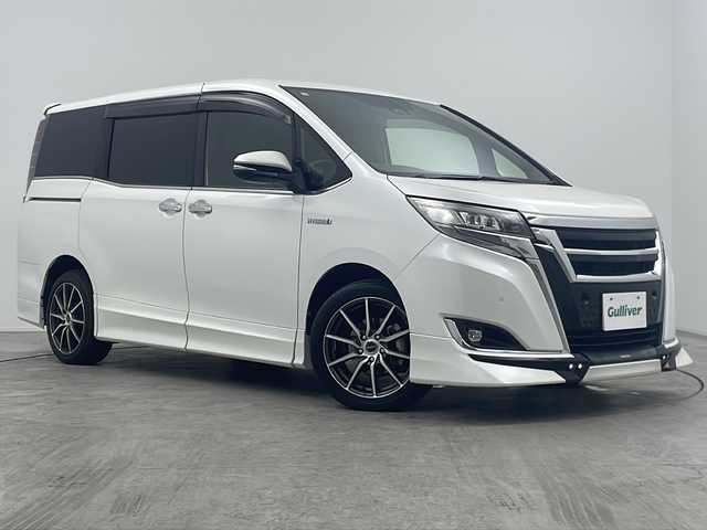 トヨタ エスクァイア ハイブリッド Gi プレミアムパッケージ 大阪府 2019(平31)年 4.9万km ホワイトパールクリスタルシャイン 禁煙車/１０インチサイバーナビ/バックカメラ/１１．６インチ社外後席モニター/ＴＲＤフルエアロ　/トヨタセーフティセンス　/両側パワースライドドア　/前後クリアランスソナー　/ＤＮ席シートヒーター　/ハーフレザーシート/WAC/ウッドコンビステアリング/オートハイビーム /ETC/LED/フォグ