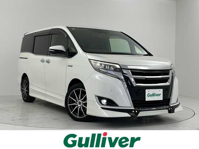 トヨタ エスクァイア ハイブリッド Gi プレミアムパッケージ 大阪府 2019(平31)年 4.9万km ホワイトパールクリスタルシャイン 禁煙車/１０インチサイバーナビ/バックカメラ/１１．６インチ社外後席モニター/ＴＲＤフルエアロ　/トヨタセーフティセンス　/両側パワースライドドア　/前後クリアランスソナー　/ＤＮ席シートヒーター　/ハーフレザーシート/WAC/ウッドコンビステアリング/オートハイビーム /ETC/LED/フォグ