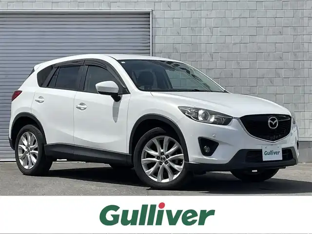 マツダ ＣＸ－５ XD Lパッケージ 道東・釧路十勝 2012(平24)年 10.1万km クリスタルホワイトパールマイカ 4WD/アルパインナビ/(FM AM CD DVD BT フルセグTV)/バックカメラ/衝突軽減ブレーキ/シートヒーター/クルーズコントロール/BOSEサウンド/ETC/プッシュスタート/スマートキー/革シート/オートライト/フォグランプ/ドアバイザー/フロアマット