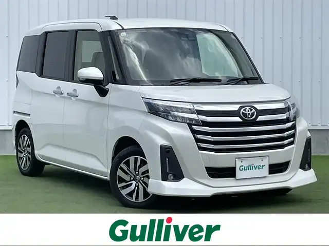 トヨタ ルーミー カスタムG 香川県 2023(令5)年 0.9万km パールホワイトⅢ 登録時走行距離 8135km/ディーラーオプション9インチナビ/→AM/FM/フルセグTV/Bluetooth/バックカメラ/プリクラッシュセーフティ/アダプティブクルーズコントロール/レーンディパーチャーアラート/クリアランスソナー/両側パワースライドドア/LEDオートライト/フォグランプ/ビルトインETC2.0/横滑り防止装置/オートホールド機能付き電子パーキング/リアサンシェード/プッシュスタート/スマートキー/スペアキー