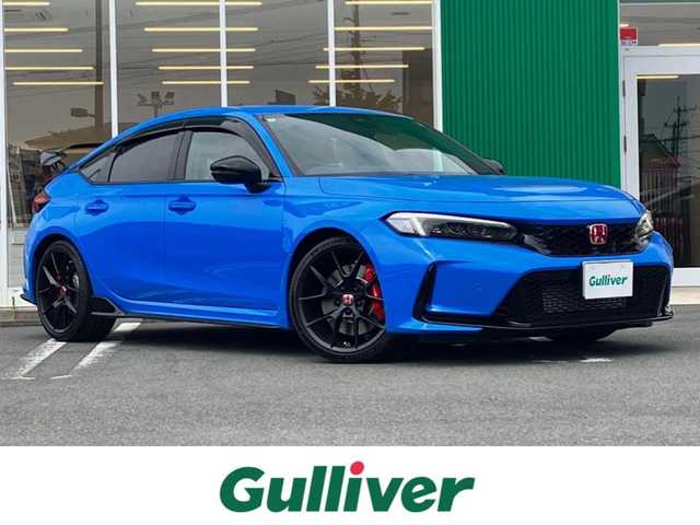 ホンダ シビック タイプR 静岡県 2025(令7)年 0.1万km レーシングブルーパール エンジンスタートボタン/保証書/取扱説明書/パワーステアリング/パワーウィンドウ/スマートキー/スペアキー１本/オートエアコン/クルーズコントロール/USB入力端子/ETC2.0/純正ナビ(BT/フルセグ)/純正フロアマット/純正アルミホイール/ABS/横滑り防止装置/レーンキープアシスト/コーナーセンサー前後/オートライト/オートマチックハイビーム/W+サイドエアバック/カーテンエアバック/衝突軽減システム/ホンダセンシング/BSM/フルLEDヘッドライト/Honda CONNECTディスプレー＋ETC2.0車載器/TYPE R専用10.2インチデジタルグラフィックメーター/Honda LogR