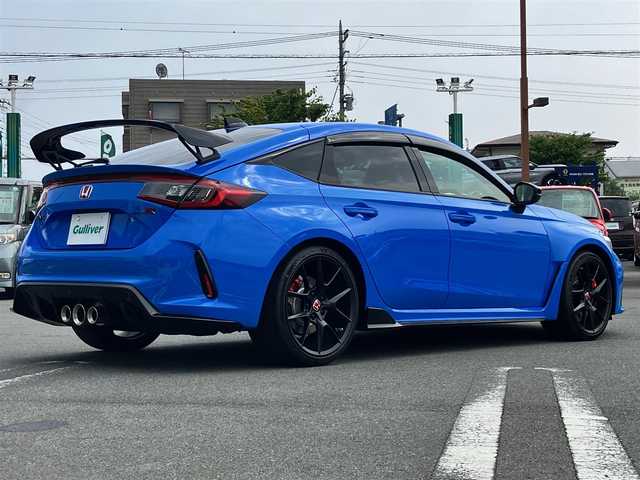 ホンダ シビック タイプR 静岡県 2025(令7)年 0.1万km レーシングブルーパール エンジンスタートボタン/保証書/取扱説明書/パワーステアリング/パワーウィンドウ/スマートキー/スペアキー１本/オートエアコン/クルーズコントロール/USB入力端子/ETC2.0/純正ナビ(BT/フルセグ)/純正フロアマット/純正アルミホイール/ABS/横滑り防止装置/レーンキープアシスト/コーナーセンサー前後/オートライト/オートマチックハイビーム/W+サイドエアバック/カーテンエアバック/衝突軽減システム/ホンダセンシング/BSM/フルLEDヘッドライト/Honda CONNECTディスプレー＋ETC2.0車載器/TYPE R専用10.2インチデジタルグラフィックメーター/Honda LogR