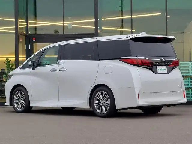トヨタ アルファードハイブリット Z 東京都 2023(令5)年 0.9万km プラチナホワイトパールマイカ ワンオーナー/GRパフォーマンスダンパーセット/左右独立ムーンルーフ/Toyota Safety Sense/・プリクラッシュセーフティ/・レーントレーシングアシスト/・先行車発進告知機能/・オートマチックハイビーム/・レーダークルーズコントロール/・クリアランスソナー/・ブラインドスポットモニター/・ヘッドアップディスプレイ/・パノラミックビューモニター/・ドライバー異常時対応システム/・アドバンスドパーク/プッシュスタート/パドルシフト/純正ナビ/フルセグTV/ETC2.0/前後ドライブレコーダー/ワイヤレス充電器/100V電源/デジタルインナーミラー/両側パワースライドドア/レザーシート/メモリー機能付きパワーシート/オットマン/パワーバックドア/シートヒーター/ベンチレーション/ステアリングヒーター/LEDヘッドライト/18インチ純正アルミホイール/スマートキー