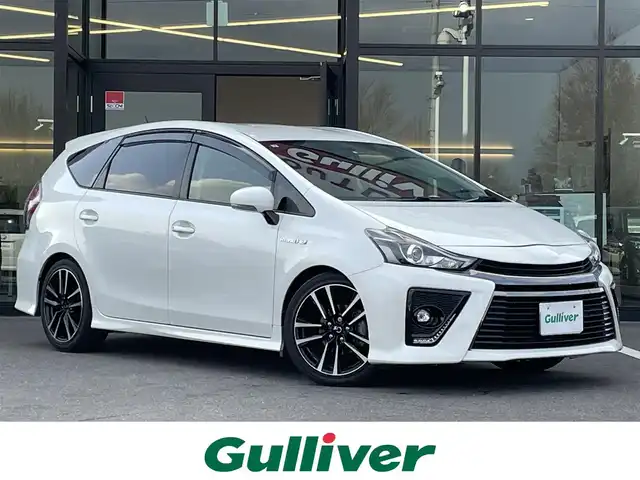 トヨタ プリウス α S ツーリングセレクション G’s 栃木県 2015(平27)年 7.9万km ホワイトパールクリスタルシャイン 純正9インチナビ/・フルセグTV/・CD/DVD/BT/・SD/AM.FM/バックカメラ/ビルトインETC/革巻きステアリング/ステアリングスイッチ/ハーフレザーシート（革調シートカバー有）/純正18インチAW/プッシュスタート/スマートキー/GPSレーダー/純正フロアマット/純正ドアバイザー/LEDヘッドライト/フォグランプ/オートライト/室内LEDランプ/横滑り防止システム/電動格納ウィンカーミラー