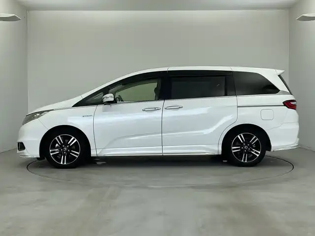 ホンダ オデッセイ ハイブリッド アブソルートセンシングアドバンP 新潟県 2016(平28)年 6.6万km ホワイトオーキッドパール メーカー純正インターナビ/(CD.DVD.フルセグ.Bluetooth)/全方位カメラ/革巻きステアリング/ステアリングリモコン/LEDオートライト/フォグランプ/ホンダセンシング/レーダークルーズコントロール/レーンキープアシスト/ハーフレザーシート/運転席パワーシート/EVモード/電動格納ウィンカーミラー/ECON/プッシュスタート/スマートキー×2/純正フロアマット