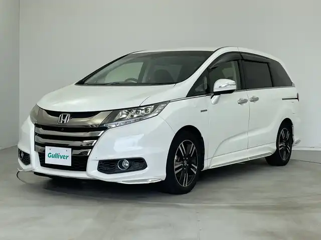 ホンダ オデッセイ ハイブリッド アブソルートセンシングアドバンP 新潟県 2016(平28)年 6.6万km ホワイトオーキッドパール メーカー純正インターナビ/(CD.DVD.フルセグ.Bluetooth)/全方位カメラ/革巻きステアリング/ステアリングリモコン/LEDオートライト/フォグランプ/ホンダセンシング/レーダークルーズコントロール/レーンキープアシスト/ハーフレザーシート/運転席パワーシート/EVモード/電動格納ウィンカーミラー/ECON/プッシュスタート/スマートキー×2/純正フロアマット