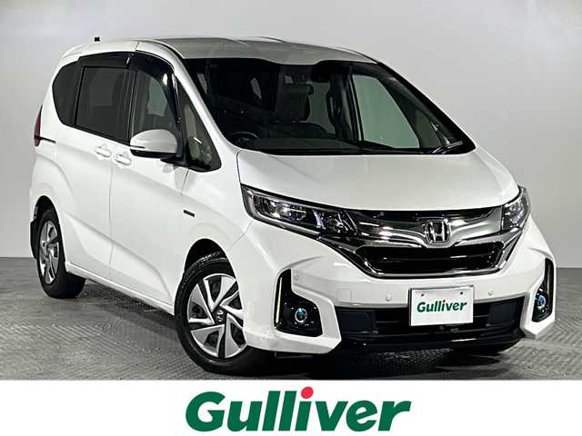 ホンダ フリード ハイブリット G ホンダセンシング 沖縄県 2019(平31)年 5.9万km ホワイトオーキッドパール 県外仕入れ/禁煙車/両側パワースライドドア/純正9インチナビ/（フルセグTV/CD/DVD/BT/FM/AM）/バックカメラ/社外フロントカメラ/ステアリングリモコン/ホンダセンシング/オートライト/前後ドライブレコーダー/コーナーセンサー/電動格納ウィンカーミラー/純正フロアマット/ドアバイザー