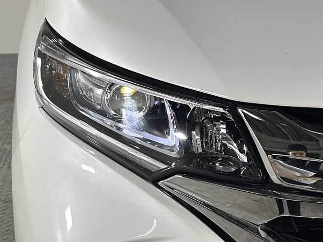 ホンダ フリード ハイブリット G ホンダセンシング 沖縄県 2019(平31)年 5.9万km ホワイトオーキッドパール 県外仕入れ/禁煙車/両側パワースライドドア/純正9インチナビ/（フルセグTV/CD/DVD/BT/FM/AM）/バックカメラ/社外フロントカメラ/ステアリングリモコン/ホンダセンシング/オートライト/前後ドライブレコーダー/コーナーセンサー/電動格納ウィンカーミラー/純正フロアマット/ドアバイザー