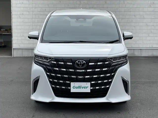 トヨタ アルファードハイブリット X 群馬県 2025(令7)年 0.2万km プラチナホワイトパールマイカ ワンオーナー/9.8インチメモリーナビ/Bluetooth/全周囲カメラ/Miracast/ルーフカラーイルミネーション/クリアランスソナー/12.4インチTFTマルチインフォメーションディスプレイ/電動格納ミラー/コネクティッドナビ/デジタルインナーミラー/TSS/BSM/パーキングアシスト/アダプティブクルーズコントロール/フルセグ/両側パワースライドドア/3眼LEDヘッドライト/パワーステアリング/AHB/チップアップシート/3列シート/フルフラットシート/純正17インチアルミホイール/純正ETC2.0/スマートキー