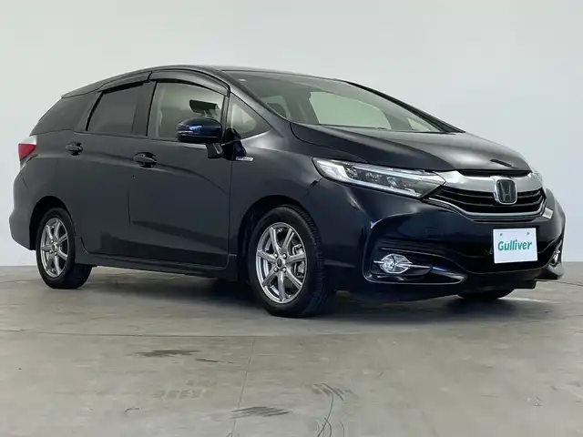 ホンダ シャトル ハイブリッド X ホンダセンシング 鹿児島県 2018(平30)年 6万km ミッドナイトブルービームM 純正ナビ（CD/DVD/BT/フルセグテレビ）/レーダークルーズコントロール/オートライト/ハーフレザーシート/パドルシフト/シートヒーター/ホンダセンシング/バックカメラ/ドラレコ/スマートキー/プッシュスタート/ETC/ステアリングリモコン