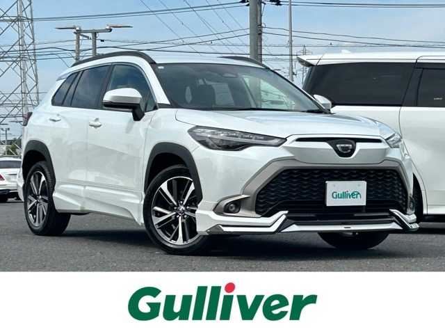 トヨタ カローラ クロス ハイブリッド Z 千葉県 2023(令5)年 2.1万km プラチナホワイトパールマイカ モデリスタエアロ/純正ディスプレイオーディオ/フルセグTV/Bluetooth/バックカメラ/ETC2.0/プッシュスタートボタン/ステアリングスイッチ/レーダークルーズコントロール/ロードサインアシスト/プロアクティブドライビングアシスト/衝突被害軽減アシスト/車線逸脱警報/オートハイビーム/ハーフレザーシート/前席シートヒーター/パワーバックドア/スペアキー×１/ウィンカーミラー/LEDヘッドライト/保証書