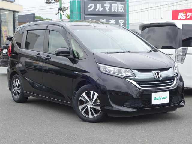 ホンダ フリード ハイブリット G ホンダセンシング 山口県 2019(平31)年 5.3万km プレミアムスパークルブラックパール ワンオーナー／禁煙車/Sパッケージ/　・15インチアルミホイル/　・革巻きステアリングホイル/　・ブラック木目調インパネ加飾/　・ブラックプライムスムース／ファブリックコンビシート/　・シートバックアッパーポケット（前席）/ホンダセンシング/　・衝突軽減ブレーキ/　・歩行者事故低減ステアリング/　・アダクティブクルーズコントロール/　・車線維持支援システム/　・路外逸脱抑制機能/　・誤発進抑制機能/　・先行車発進のお知らせ機能/　・標識認識機能/Gathers 9インチナビ/　CD/DVD/SD/BT/フルセグTV/バックカメラ/ビルトインETC/両側パワースライドドア/スマートキー／プッシュスタート/純正フロアマット／ドアバイザー/取扱説明書／保証書