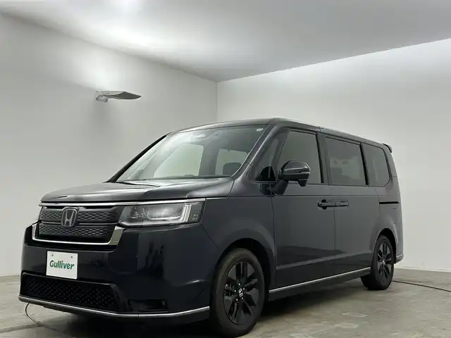 ホンダ ステップワゴン スパーダ eHEV 岡山県 2023(令5)年 2.9万km トワイライトミストブラックパール 純正８インチナビ/（CD/DVD/BT/USB/フルセグ）/衝突軽減ブレーキ/両側電動スライド/追従型クルーズコントロール/ビルトインＥＴＣ/シートヒーター（前席・中席）/ＬＥＤヘッドライト/オートハイビーム/オートライト/コーナーセンサー（前・後）/プッシュスタート/スマートキー×１/アイドリングストップ/レーンキープアシスト/純正16インチAW/踏み間違い防止/オートブレーキホールド/ブラインドスポットモニター/ISOFIX/後席サンシェイド/ステアリングスイッチ/チルトステアリング/シートリフター/シートバックテーブル/ウインカーミラー/バックカメラ/ドライブレコーダー（前・後）/デジタルインナーミラー/電動リアゲート