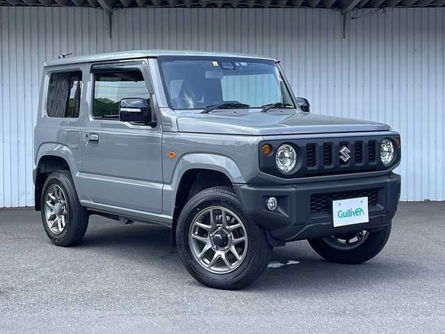 スズキ ジムニー XC 長野県 2023(令5)年 0.8万km ミディアムグレー ４WD/スズキセーフティサポート/ストラーダメモリナビフルセグTV/ドライブレコーダー/ETC/シートヒーター /純正16インチアルミ/社外マフラー/純正マフラー積込/ワンオーナー /保証書・取説/スペアキー