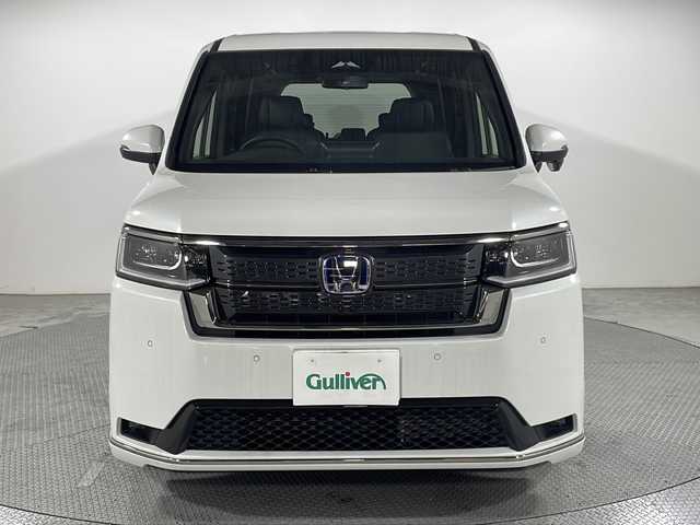 ホンダ ステップワゴン スパーダ eHEV 広島県 2025(令7)年 0.1千km プラチナホワイトパール 登録済未使用車（5km）/純正１１．４型ナビ /両側パワースライドドア /パワーテールゲート /バックカメラ/シートヒーター/2列目オットマン/ハーフレザーシート/ホンダセンシング/・衝突軽減ブレーキ/・レーンキープアシスト/・アダプティブクルーズコントロール/・オートハイビーム/・ブラインドスポットモニター/・誤発進抑制機能/・パーキングセンサー/LEDヘッドランプ/USB入力端子/純正16インチAW