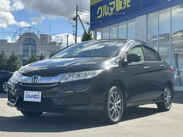 ホンダ グレイス ハイブリッド LX 道北・旭川 2015(平27)年 8.9万km クリスタルブラックパール (株)IDOMが運営する【じしゃロン旭川店】の自社ローン専用車両になります。こちらは現金またはオートローンご利用時の価格です。自社ローンご希望の方は別途その旨お申付け下さい/　/・社外ナビ(CD/DVD/BT/SD/フルセグ)/・バックカメラ/・クルーズコントロール/・ステアリングリモコン/・両席シートヒーター/・積込スタッドレスタイヤ 185/60R15/・取扱説明書