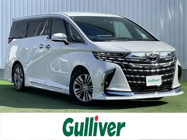 トヨタ アルファードハイブリット Z 香川県 2023(令5)年 3.1万km プラチナホワイトパールマイカ メーカーナビ/１３．２型後席モニター/全方位カメラ/チームメイト/モデリスタエアロ　　/独立ムーンルーフ　/トヨタセーフティセンス　/パワーバックドア　/両側パワースライドドア　/黒革シート/前席シートオプション/・シートヒーター/・エアシート/・パワーシート/運転席メモリ付きシート/デジタルインナーミラー/BSM　/ＨＵＤ　/ＬＥＤヘッドライト/オートライト/オートハイビーム　/ワイヤレス充電　/ビルトインＥＴＣ2.0/前後ドライブレコーダー