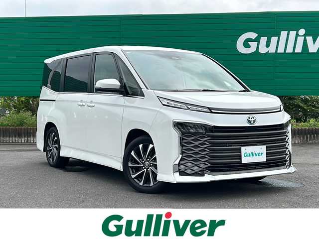 トヨタ ヴォクシー ハイブリッド S－Z 茨城県 2023(令5)年 1.3万km ホワイトパールクリスタルシャイン 純正ナビ/【AM・FM・BT・USB】/シートヒーター/ブレーキホールド/レーダークルコン/電動パーキングブレーキ/ETC/Bカメラ/前後コーナーセンサー/両側パワスラ/100V電源/オートライト/オートハイビーム/LEDライト/純正アルミホイール