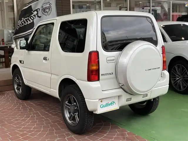 スズキ ジムニー ランドベンチャー 神奈川県 2018(平30)年 2.7万km パールホワイト 1オーナー/社外SDナビ(CN-RA04D)/バックカメラ/レザーシート/運転席シートヒーター/carrozerriaサブウーファー/前後ドライブレコーダー/社外LEDヘッドライト/背面タイヤハードカバー