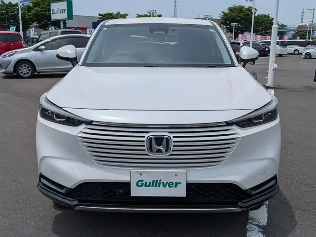 ホンダ ヴェゼル ハイブリッド e:HEV Z 福井県 2021(令3)年 6.1万km プラチナホワイトパール ワンオーナー車/純正18インチAW/バックカメラ/全方位ドライブレコーダー/ワイヤレス充電/パドルシフト/ステアリングヒーター/SOSボタン/電動リアゲート/アダプティブクルーズコントロール/前後コーナーセンサー/クリアランスソナー/純正9インチプレミアムインターナビ/フルセグテレビ/ETC/衝突被害軽減システム/前席シートヒーター/レーンキープアシスト/横滑り防止装置/盗難防止装置/スマートキー