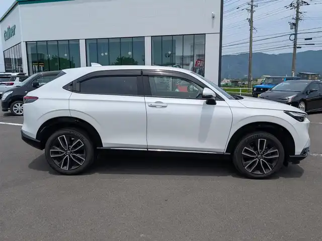 ホンダ ヴェゼル ハイブリッド e:HEV Z 福井県 2021(令3)年 6.1万km プラチナホワイトパール ワンオーナー車/純正18インチAW/バックカメラ/全方位ドライブレコーダー/ワイヤレス充電/パドルシフト/ステアリングヒーター/SOSボタン/電動リアゲート/アダプティブクルーズコントロール/前後コーナーセンサー/クリアランスソナー/純正9インチプレミアムインターナビ/フルセグテレビ/ETC/衝突被害軽減システム/前席シートヒーター/レーンキープアシスト/横滑り防止装置/盗難防止装置/スマートキー