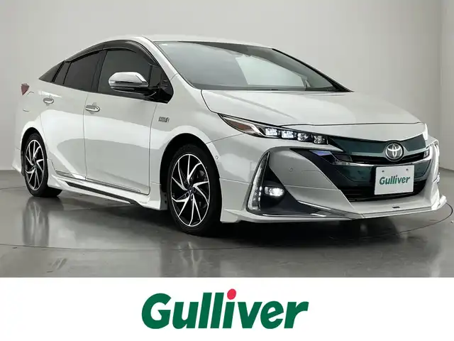 トヨタ プリウス ＰＨＶ A 愛知県 2017(平29)年 5.3万km ホワイトパールクリスタルシャイン 純正１１．６型ナビ　バックカメラ　フルセグTV　Bluetooth　モデリスタエアロ　シートヒーター　パーキングアシスト　ＢＳＭ　ＥＴＣ２．０　純正ドラレコ　ＡＣ１００Ｖ　セーフティセンス　衝突軽減　追従クルコン　ＬＥＤライト　コーナーセンサー　モデリスタ17インチアルミ　USBポート　禁煙
