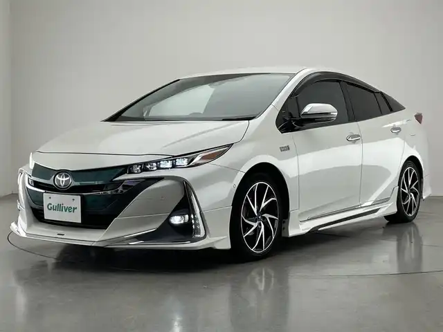 トヨタ プリウス ＰＨＶ A 愛知県 2017(平29)年 5.3万km ホワイトパールクリスタルシャイン 純正１１．６型ナビ　バックカメラ　フルセグTV　Bluetooth　モデリスタエアロ　シートヒーター　パーキングアシスト　ＢＳＭ　ＥＴＣ２．０　純正ドラレコ　ＡＣ１００Ｖ　セーフティセンス　衝突軽減　追従クルコン　ＬＥＤライト　コーナーセンサー　モデリスタ17インチアルミ　USBポート　禁煙