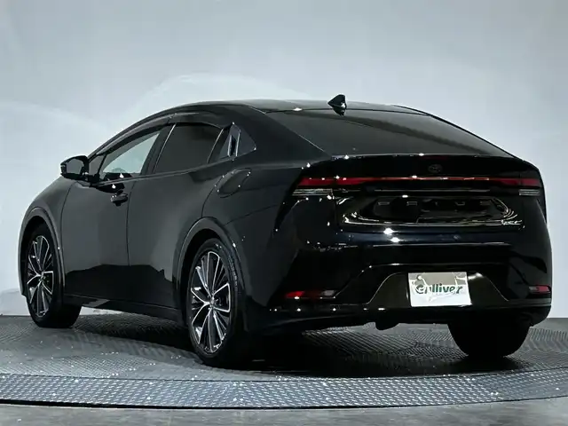 トヨタ プリウス Z 愛媛県 2024(令6)年 2.1万km アティチュードブラックマイカ ・１２．３型ナビ（フルセグＴＶ・ＢＴ・ＦＭＡＭ・ＵＳＢ）/・全方位カメラ　/・ビルトインＥＴＣ２．０　/・デジタルインナーミラー　/・レーダークルーズコントロール　/・オートマチックハイビーム　/・ステアリングヒーター/・パワーバックドア/・置くだけ充電/・パーキングアシスト/・ドリンクホルダー/・シートメモリー