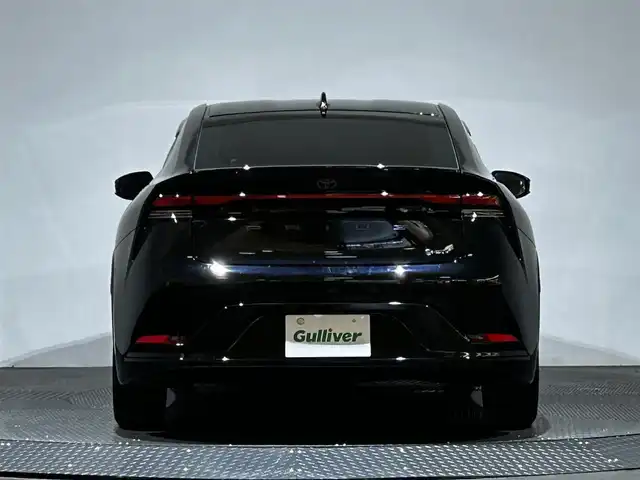 トヨタ プリウス Z 愛媛県 2024(令6)年 2.1万km アティチュードブラックマイカ ・１２．３型ナビ（フルセグＴＶ・ＢＴ・ＦＭＡＭ・ＵＳＢ）/・全方位カメラ　/・ビルトインＥＴＣ２．０　/・デジタルインナーミラー　/・レーダークルーズコントロール　/・オートマチックハイビーム　/・ステアリングヒーター/・パワーバックドア/・置くだけ充電/・パーキングアシスト/・ドリンクホルダー/・シートメモリー
