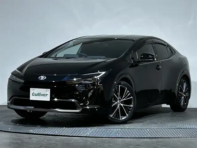 トヨタ プリウス Z 愛媛県 2024(令6)年 2.1万km アティチュードブラックマイカ ・１２．３型ナビ（フルセグＴＶ・ＢＴ・ＦＭＡＭ・ＵＳＢ）/・全方位カメラ　/・ビルトインＥＴＣ２．０　/・デジタルインナーミラー　/・レーダークルーズコントロール　/・オートマチックハイビーム　/・ステアリングヒーター/・パワーバックドア/・置くだけ充電/・パーキングアシスト/・ドリンクホルダー/・シートメモリー