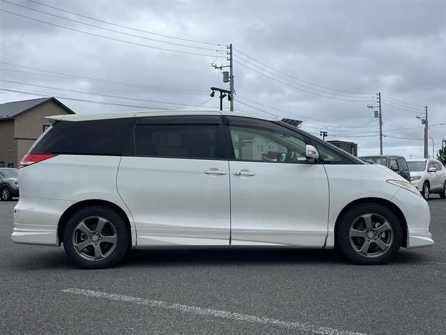 トヨタ エスティマ G 道央・札幌 2006(平18)年 17.6万km ホワイトパールクリスタルシャイン ４WD/寒冷地仕様/純正ディーラーOPナビ/CD/DVD/SD/フルセグ/純正フリップダウンモニター/クルーズコントロール/バックカメラ/ビルトインETC/センターデフロック/AFS/両側パワースライドドア/パワーバックドア/D席パワーシート/電動格納サードシート/2列目オットマン/レザー調シートカバー/革巻きウッドコンビステアリング/MTモード付AT/プッシュスタート/スマートキー/ハロゲンヘッドライト/オートライト/フォグランプ/電動格納ミラー/ウィンカーミラー/純正フロアマット/ドアバイザー/スペアキー/社外エンジンスターター