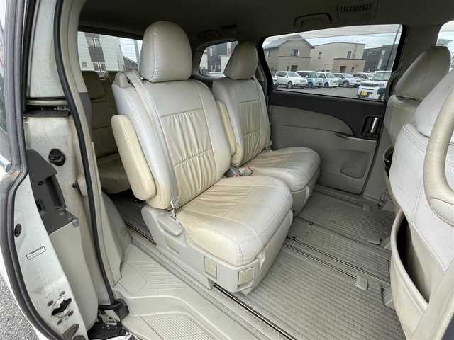 トヨタ エスティマ G 道央・札幌 2006(平18)年 17.6万km ホワイトパールクリスタルシャイン ４WD/寒冷地仕様/純正ディーラーOPナビ/CD/DVD/SD/フルセグ/純正フリップダウンモニター/クルーズコントロール/バックカメラ/ビルトインETC/センターデフロック/AFS/両側パワースライドドア/パワーバックドア/D席パワーシート/電動格納サードシート/2列目オットマン/レザー調シートカバー/革巻きウッドコンビステアリング/MTモード付AT/プッシュスタート/スマートキー/ハロゲンヘッドライト/オートライト/フォグランプ/電動格納ミラー/ウィンカーミラー/純正フロアマット/ドアバイザー/スペアキー/社外エンジンスターター