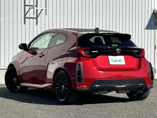 トヨタ ＧＲヤリス RS 熊本県 2021(令3)年 6.2万km エモーショナルレッドⅡ 純正ナビ/・AM/FM/USB/BT/バックカメラ/トヨタセーフティセンス/・レーントレーシングアラート/・プリクラッシュセーフティシステム/・ブラインドスポットモニター/・クリアランスソナー/・リヤクロストラフィックアラート/・パーキングサポートブレーキ/・ヘッドアップディスプレイ/・ロードサインアシスト/・レーダークルーズコントロール/・オートマチックハイビーム/前後コーナーセンサー/車両接近通報装置/革巻きステアリング/・ステアリングリモコン/・パドルシフト/・ステアリングヒーター/オートライト/・LEDライト/・フォグランプ/・ヘッドライトレベライザー/D/N席シートヒーター/前後ドライブレコーダー/ETC/電動格納ミラー/・ウィンカーミラー/レーザー探知機（ZERO307LV）/電動サイドブレーキ/・ホールドボタン/トノカバー/純正フロアマット/純正アルミホイール/社外マフラー（ガナドール）/スマートキー/・スペアキー