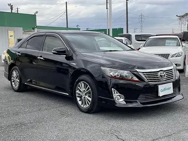 トヨタ カムリ ハイブリット Gパッケージ プレミアムブラック 千葉県 2014(平26)年 9.3万km アティチュードブラックマイカ 社外エアロ/純正HDDナビ【NHZD-W62G】/・CD/DVD/MSV/Bluetooth/フルセグ/バックカメラ/ハーフレザーシート/運転席パワーシート/スマートキー/クルーズコントロール/純正16インチアルミホイール/ウッドコンビステアリング/純正LEDヘッドライト/フォグランプ/ビルトインETC/ドアバイザー/サイド＆カーテンエアバッグ/新車時保証書＆取扱説明書