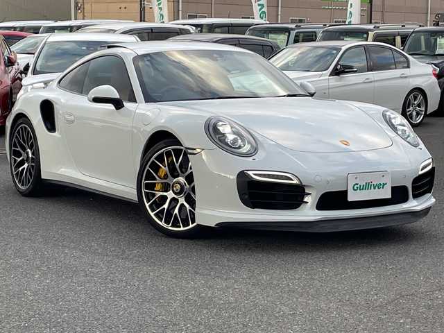 ポルシェ ９１１ ターボS 広島県 2016(平28)年 3万km キャララホワイトメタリック サンルーフ/スポーツクロノパッケージ/ポルシェ・アダプティブ・エアロダイナミクス（ＰＡＡ）/・可変フロントスポイラー/・自動調整リアウイング/ポルシェ・ダイナミック・シャシーコントロール（ＰＤＣＣ）/ポルシェ・セラミックコンポジット・ブレーキ（ＰＣＣＢ）/・イエローキャリパー/Clarionナビ（CD/DVD/フルセグTV/Bluetooth）/バックカメラ/ETC/ドライブレコーダー/赤レザーシート/・シートヒーター/・エアシート/・パワーシート/クルーズコントロール/LEDヘッドライト/純正20インチAW/ステアリングスイッチ/スペアキー