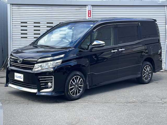 トヨタ ヴォクシー ZS 煌 道央・札幌 2016(平28)年 14万km ブラック ・プッシュスタート/・スマートキー/・４WD/・純正ナビ9インチナビ/BT/TV/AM/FM/・バックカメラ/・両側パワースライドドア/・フリップダウンモニター/・ETC/・横滑り防止装置/・衝突軽減システム/・レーンキープアシスト/・純正アルミ/・純正マット