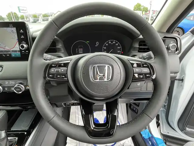 ホンダ ヴェゼル ハイブリッド e:HEV Z 群馬県 2025(令7)年 0.1万km未満 プレミアムサンライトホワイトパール ワンオーナー/純正ナビ/　(AM/FM/TV/BT/USB)/パワーバックドア/ハンズフリーアクセスパワーテールゲート/バックカメラ/ホンダセンシング/路外逸脱抑制機能/踏み間違い衝突軽減システム/衝突軽減ブレーキ/ブラインドスポットモニター/コーナーセンサー/ヒルディセントコントロール/横滑り防止機能/レーダークルーズコントロール/ETC2.0/AUTOライト/LEDヘッドライト/LEDフォグライト/前席シートヒーター/ステアリングヒーター/ステアリングリモコン/パドルシフト/置くだけ充電/シーケンシャルウィンカー/取扱説明書/保証書/スペアキー1つ