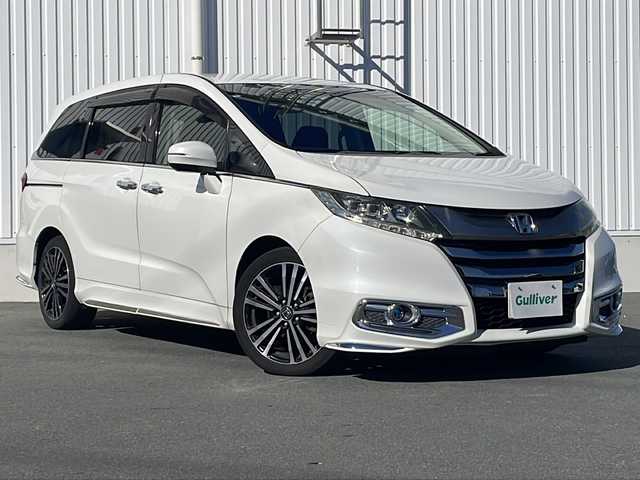 ホンダ オデッセイ アブソルート EX 三重県 2015(平27)年 10.7万km ホワイトオーキッドパール 禁煙/ALPINE9型ナビ/ALPINE後席モニター/バックカメラ/ETC/前後ドラレコ/BSM/両側パワースライドドア/レーンキープアシスト/レーダークルーズコントロール/プリクラッシュ/LEDオートライト/フォグランプ/ステアリングスイッチ/パドルシフト/電動格納ミラー