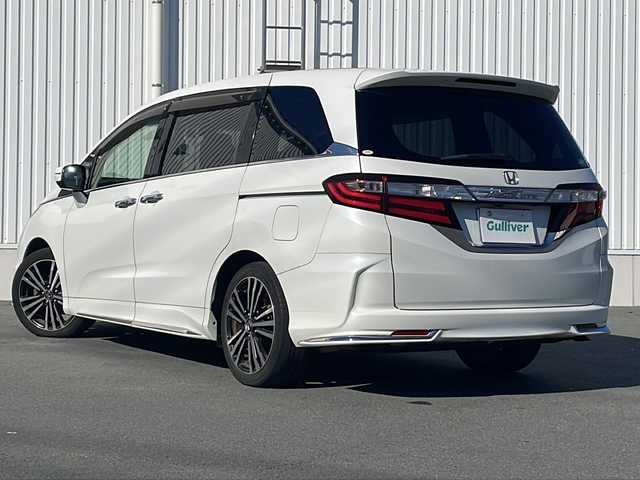 ホンダ オデッセイ アブソルート EX 三重県 2015(平27)年 10.7万km ホワイトオーキッドパール 禁煙/ALPINE9型ナビ/ALPINE後席モニター/バックカメラ/ETC/前後ドラレコ/BSM/両側パワースライドドア/レーンキープアシスト/レーダークルーズコントロール/プリクラッシュ/LEDオートライト/フォグランプ/ステアリングスイッチ/パドルシフト/電動格納ミラー